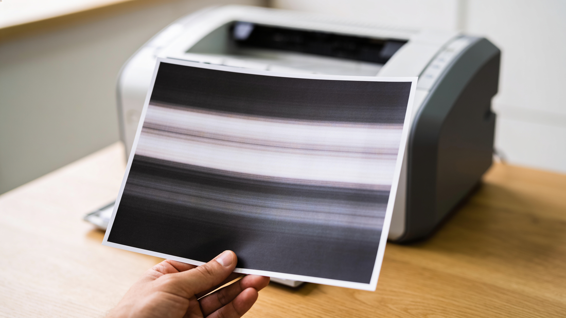 A printed page with streaks and banding caused by a printing problem